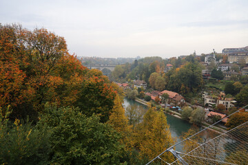 View of the river and old bridge in autumn season is the beautiful nature from bern - obrazy, fototapety, plakaty
