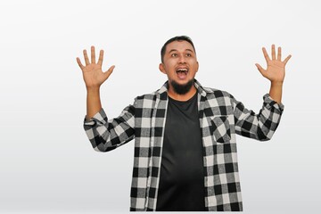 Man over isolated white background with shocked facial expression
