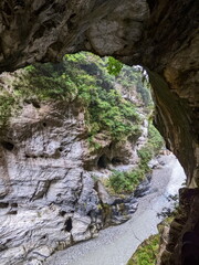 Taroko, Taiwan - 11.26.2022: Viewing swallow hollows and potholes on marble cliffs along Liwu River from Swallow Grotto Trail under sunlight on a rainy day before 403 earthquake during the pandemic