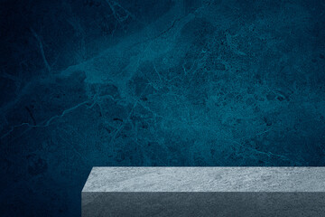 edge of grey slate stone counter with blank space for product montage display with blue marble stone at background. border of stone table for decoration in modern style. front view of table.