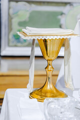 Catholic concept. Golden chalice for mass in catholic church.