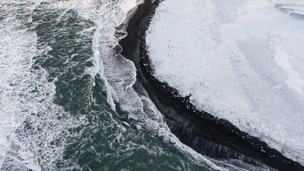 winter water flowing into the sea drone view