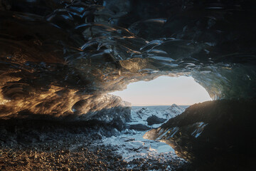iceland winter icecave with sunrise