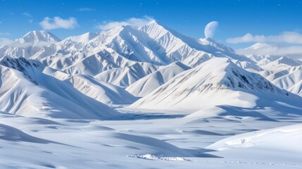   A mountain range, cloaked in snow, nestles under a blue sky A half moon hangs centrally within the range