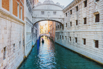 Fototapeta na wymiar View of the gondolas of the Grand Canal on a sunny day in Venice, Italy. Bridge of Sighs.