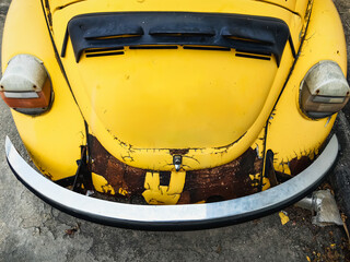 Damaged and peeling car paint surfaces due to age and incorrect paint care. Rust of old car. Rust...