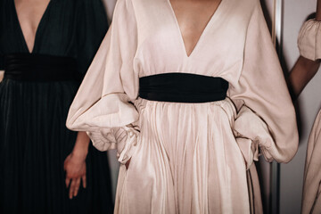 Fashion elegant feminine details of spring summer beige long dress with black wide belt