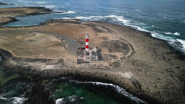 The peninsula with the El Cotillo Lighthouse, Fuerteventura, Canary Islands, Spain. High-quality drone footage. 