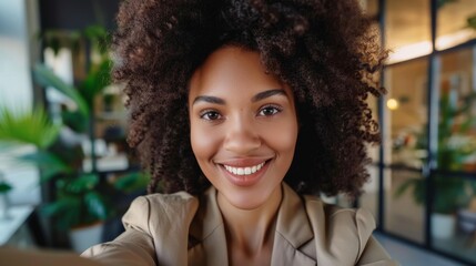 Obraz premium Businesswoman selfie and headshot with pleasant smile, new corporate job, and employee pleasure. Happy workplace, office, or online update on social media