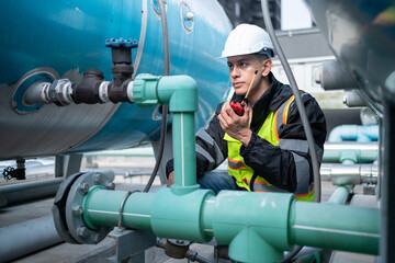 Industrial Engineer Checking Equipment with Tool