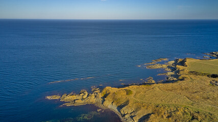 A panoramic view of the sea and rocky coves on the coast of the Black Sea in Bulgaria. This aerial photograph captures the stunning beauty of the coves and the sea.