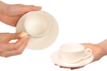 Female hand holding coffee cup and saucer isolated on white background.