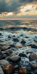 Obraz premium Waves wash ashore during a beautiful sunset. sky sunset in the clouds, stones in the sea or ocean, corals, wave movement