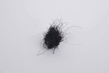 Hair loss coils with white isolated object.