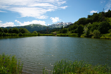 Obraz premium Beautiful mountain landscape in early spring. Cold blue lake.