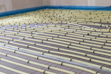 Underfloor heating system installation. Water floor heating system indoor