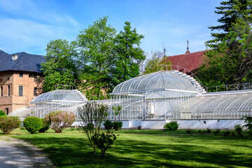 Old historical buiding of a greenhouse at Mogosoaia Palace (Palatul Mogosoaia) near the lake and...