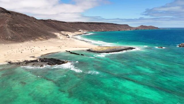 Overview, from above, over Ponta da Fragata, Sal, Cape Verden, panning from the land to the coast
