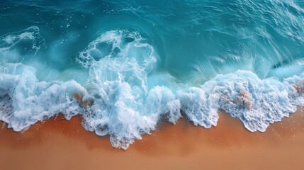 Background with waves on a golden sand beach. Blue water behind golden sand beach