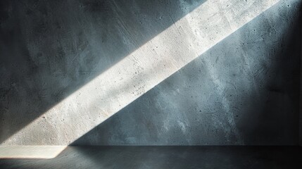 A dramatic play of light and shadow on a textured concrete wall, inspiring simplicity and contemporary design.