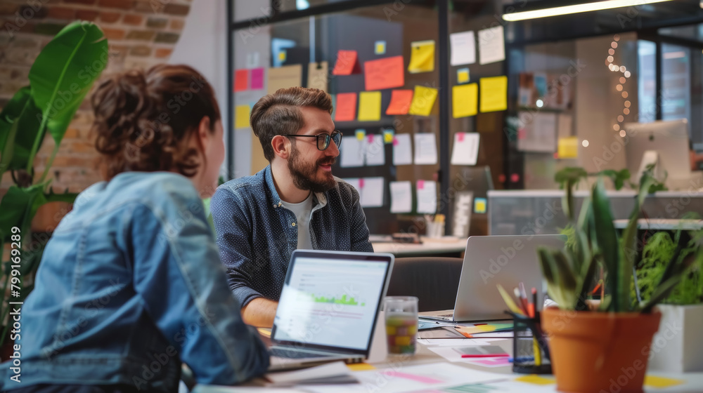 Poster startup interview in office with tech and project boards