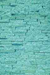 Gray wall of rough brick. Abstract construction background.