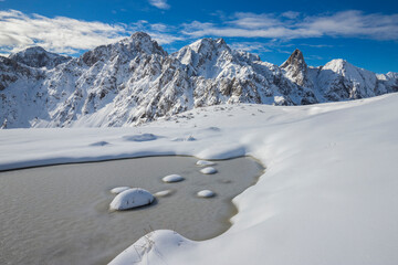 Peacks of Dolomiti Camune park in a sunny winter morning , Lombardy, Italy.	