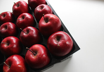 Juicy Red Apples Inside Compartments Of Storage Case For Fruits 