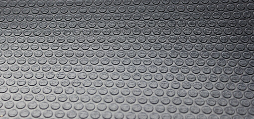 Abstract texture of rows of small circles on dark gray shockproof material free royalty photo for...