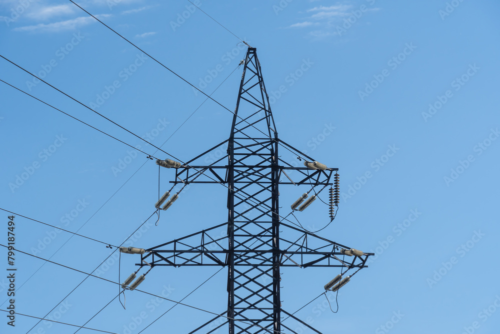 Wall mural electricity transmission towers and power lines in blue sky. detail high voltage pole. energy concep