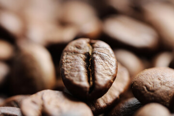 Roasted coffee beans close up background