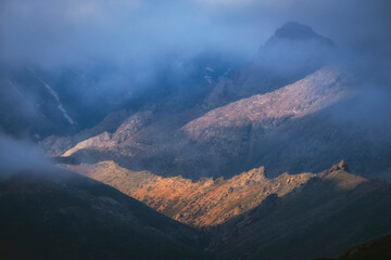 Foggy and pointed dolomite mountains after a thunderstorm, Kelinshektau Mountains in the Karatau massif in Kazakhstan