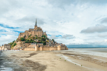 Mont Saint Michel abbey on the island during low tide, Normandy, Northern France, Europe. Tidal...
