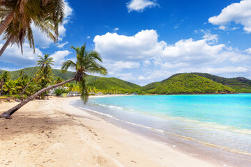 The beautiful beach of Carlisle Bay at the Caribbean islands of Antigua and Barbuda with fine sand...