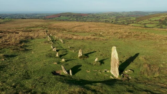 Hurston Ridge double stone row prehistoric late Neolithic 3000 – 2300 BC site near Postbridge, Dartmoor, England. Aerial video moving N.E. down row