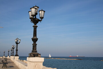 Embankment promenade Imperatore Augusto with street light and view of Adriatic sea in the city of...