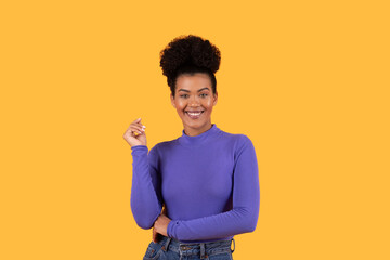 Woman Wearing Purple Shirt and Jeans on Yellow