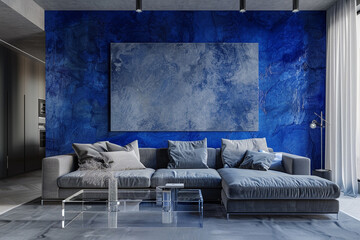 A minimalist living room with a cobalt blue polished plaster wall. The space is furnished with a simple grey sofa, a clear acrylic coffee table, and a large, abstract canvas in monochrome hues.