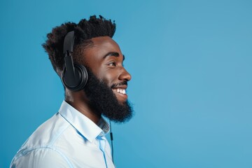Customer service headset, cheerful black dude, ecommerce service consultancy, help desk guidance, or contact us. Telemarketing, studio face, or African microphone speaker on blue background.