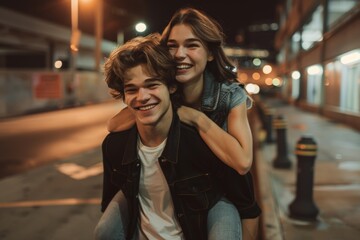 Couple of buddies, piggyback or fun night out on the street or road for birthday, romance, or silly game. Smile, cheerful, or guy carrying woman on back in silly bonding.