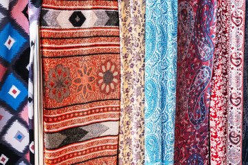 Traditional silk Indian scarves with a bright colorful pattern close-up