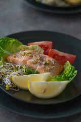 Delicious plate with baked salmon. salad with baked salmon