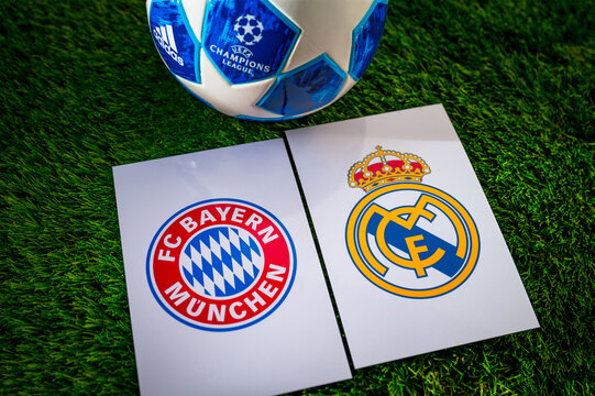 Bayern Munich (GER) vs Real Madrid (ESP). Semifinals of football UEFA Champions League 2024 in Europe. Logo of teams and official soccer ball on green grass