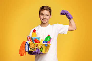 Young Boy Holding Basket of Cleaning Supplies