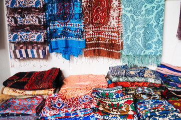 Traditional Uzbek scarves with a bright colorful pattern at the oriental bazaar in Tashkent in...