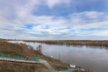 early spring flood, high water in the countryside, river overflowing its banks, trees in the water,...