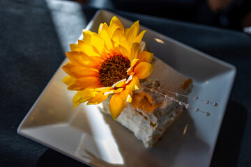 Sunflower Adornment on Delicate Cake Slice