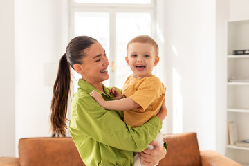 Woman Holding Child in Her Arms, Home Interior