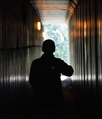 silhouette of a person in a hall