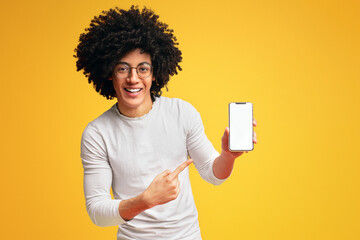 African-american millennial man showing blank cellphone screen